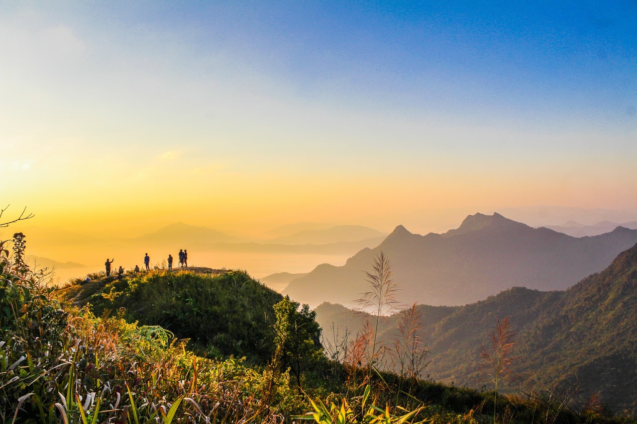 Tours Photo Of People Standing On Top Of Mountain Near Grasses 733162